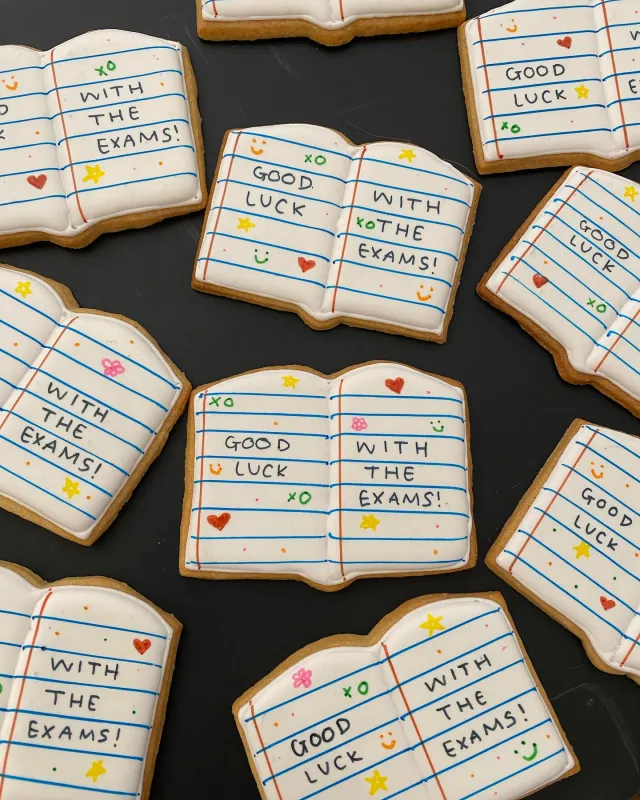Open-book cookies iced with Good luck with the exams