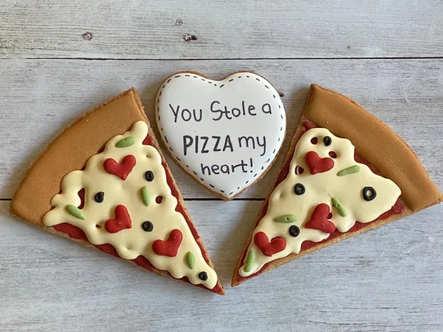 Pizza slice cookies with a You stole a pizza my heart cookie