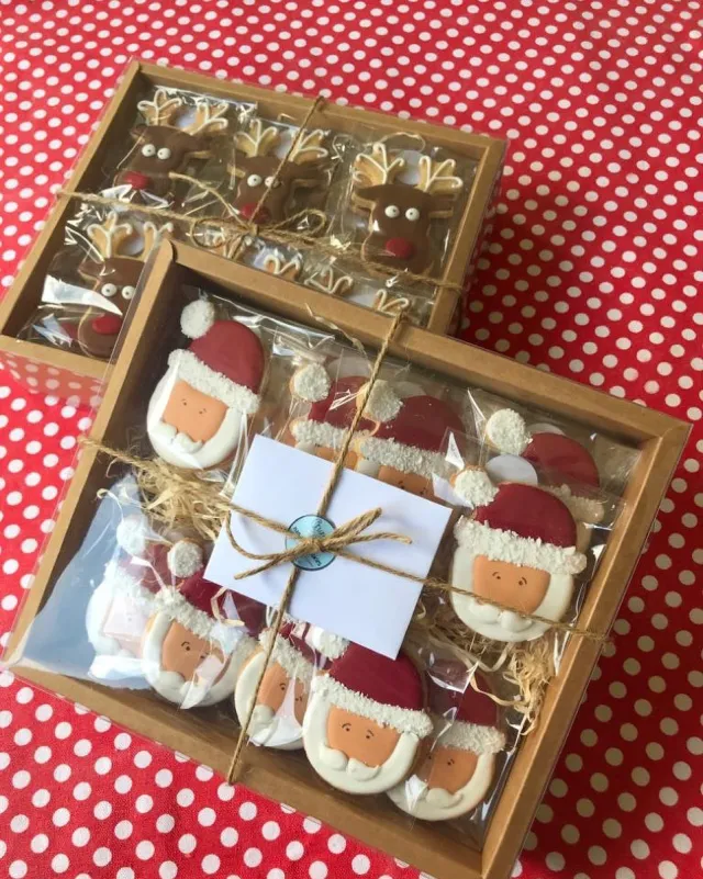Wooden box of Santa cookies on a red polka dot cloth