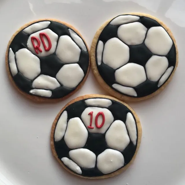 Soccer ball cookies with initials and the number 10