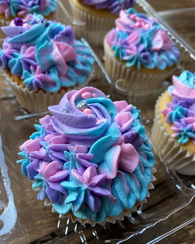 Cupcakes with purple and blue buttercream swirls